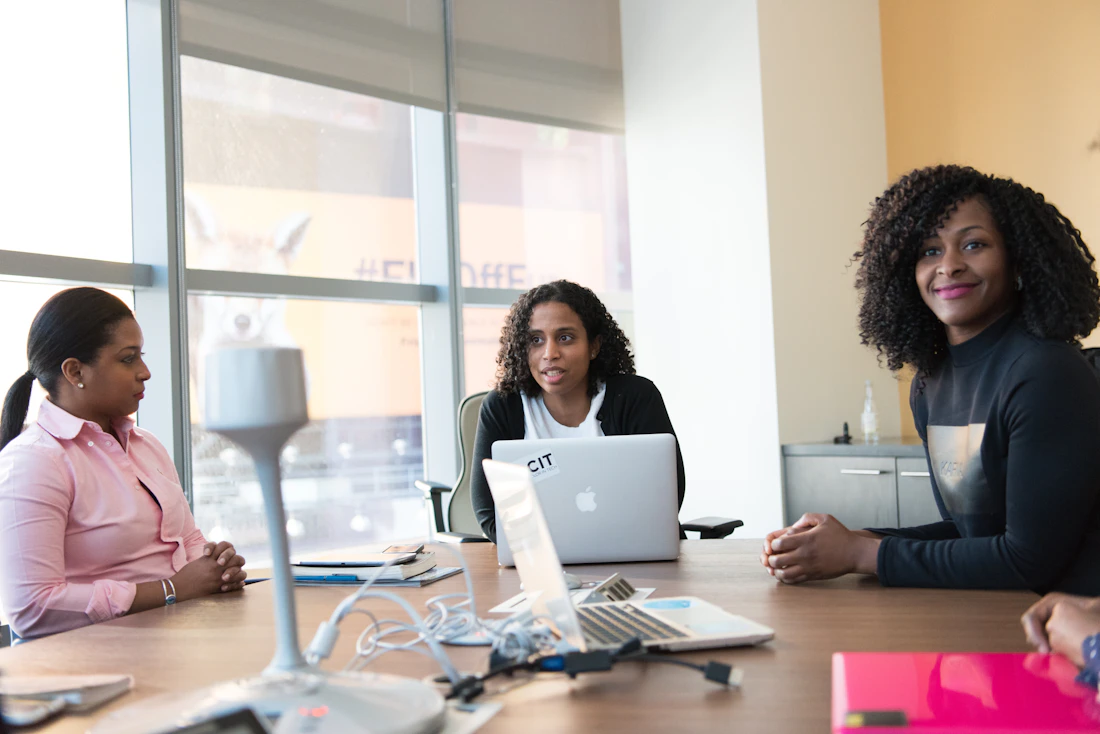 Professionals discussing ideas together around a table
